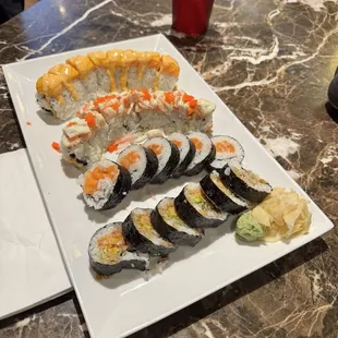 Salmon roll, Salmon and Mango Roll, Shrimp Tempura, and I can&apos;t remember the other one