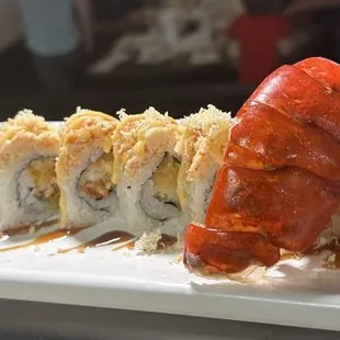 a plate of sushi rolls on a table