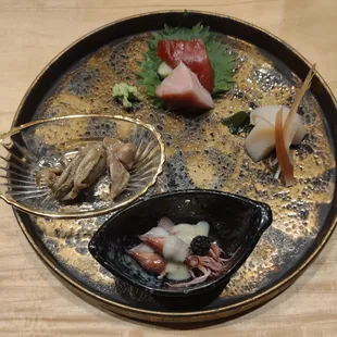 Appetizer (clockwise from right) - Hokkaido scallop with myoga ginger, firefly squid, Pacific oysters, otoro (behind the gill) and chutoro