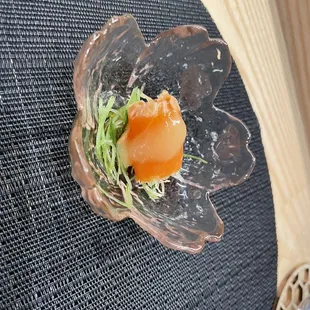 amuse bouche of king salmon with garlic chives