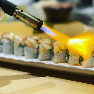 white deer roll 
Torched super white tuna on the top.