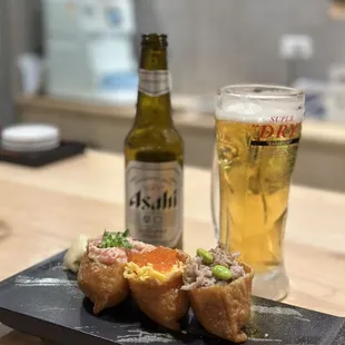 sushi rolls and a beer