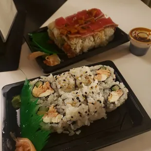 two plates of sushi on a table