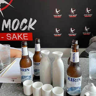 a variety of beer bottles and cups