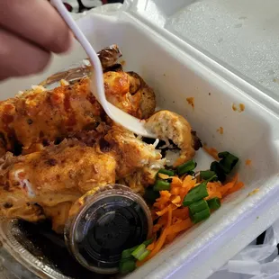 a close up of a plastic container with food in it