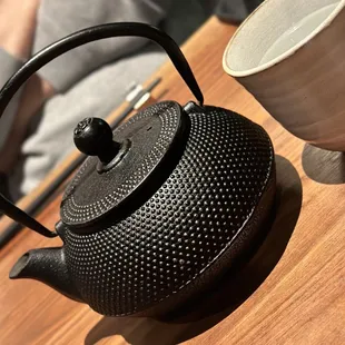 Hot water keeps in the cast iron tea pot.