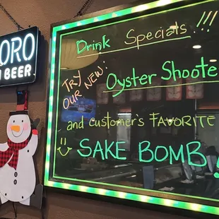 a neon sign with a snowman on it