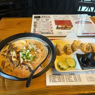 Spicy chicken ramen with dumplings