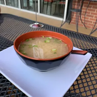 a bowl of soup on a plate