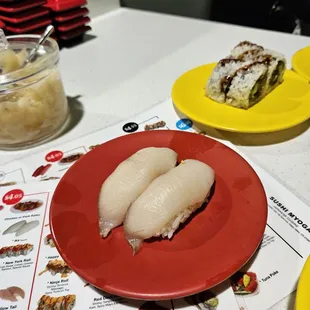 The chef expected us to believe this nigiri sushi is topped with Hamachi.