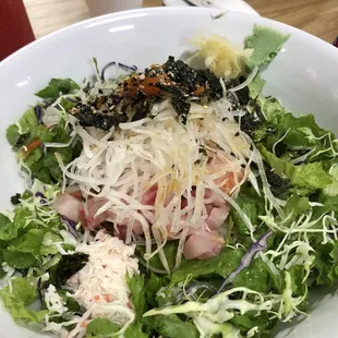 a bowl of salad on a table