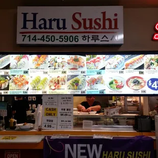 Welcome to Haru Sushi inside Han Nam Chain Super 1 Mart. The menu board is on display.