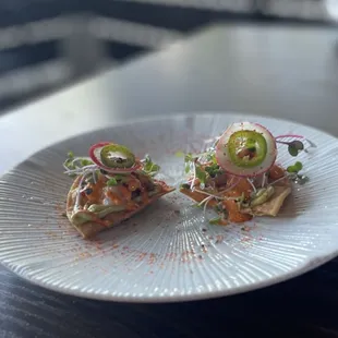 Two pieces left of hamachi tostada