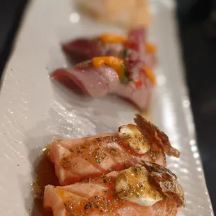 Sweet salmon, tuna, and parmesan scallop sushi.