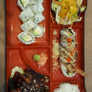 Three item bento box: chicken teriyaki, crunch roll, and california roll. It also comes with side salad and white rice.