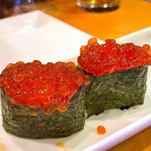 two pieces of sushi on a plate