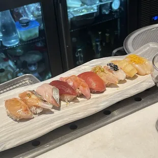 a long rectangular platter of sushi