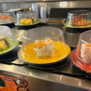 a variety of sushi on plates