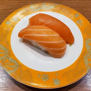 two pieces of salmon on a plate