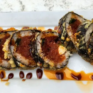 Hercules - pretty good. Deep fried roll with spicy tuna, salmon, avocado and cream cheese inside.