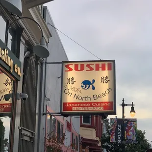 Sign outside and nice patio area.
