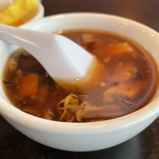 a bowl of soup with a spoon in it