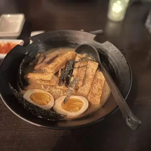 a bowl of ramen with boiled eggs