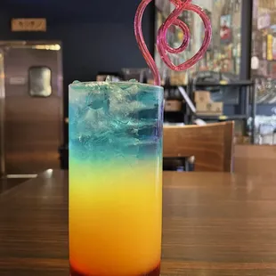 Try out our newest cocktail today! The sunset consist of Grenadine, soju, pineapple orange juice, and blue curaçao