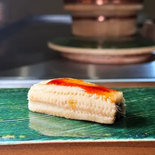 a piece of sushi on a plate