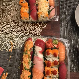 Front- back, L to R- Mountain, Rainbow, Volcano rolls, salmon and tuna sushi, Christmas, Fusion, Pop up rolls, salmon and yellowtail sushi