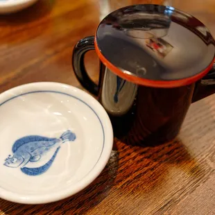 a coffee cup and saucer on a wooden table