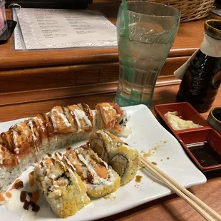 a plate of sushi and chopsticks