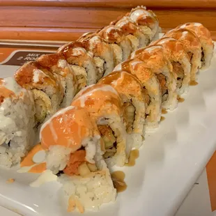 a plate of sushi rolls