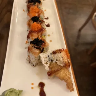 a plate of sushi rolls