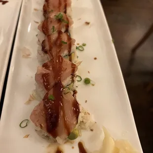 a long rectangular plate of sushi