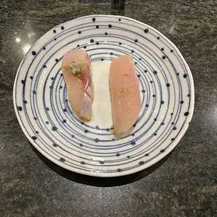 two pieces of fish on a plate