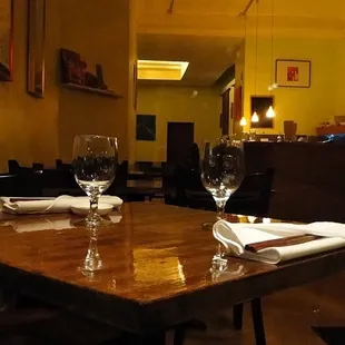 a table with two wine glasses on it