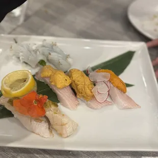 a close up of a plate of sushi