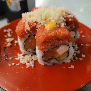 a sushi roll on a red plate