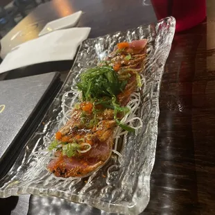 a plate of sushi on a table