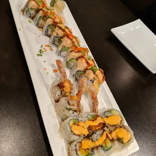 a long rectangular platter of sushi