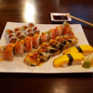 Back to front: spicy scallop roll, Millennium roll, fire roll, tamago