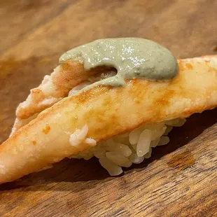 a piece of food on a wooden table