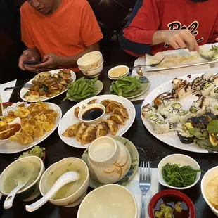 Family sushi dinner spread