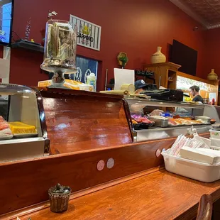 a restaurant counter with food on it
