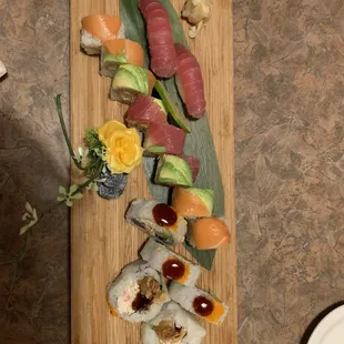 a variety of sushi on a cutting board