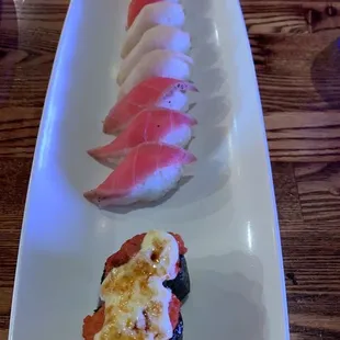 a plate of sushi rolls