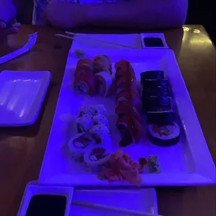 Spicy tuna roll (bottom left), Rainbow roll with Alaskan snow crab (top left) Red Hot Chili Peppers roll (middle), Sushi Rock roll (right).