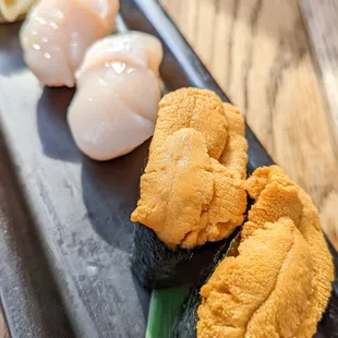 Hotate (scallop) nigiri and uni (sea urchin) nigiri