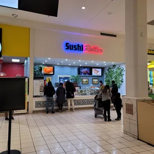 people standing in line at the counter